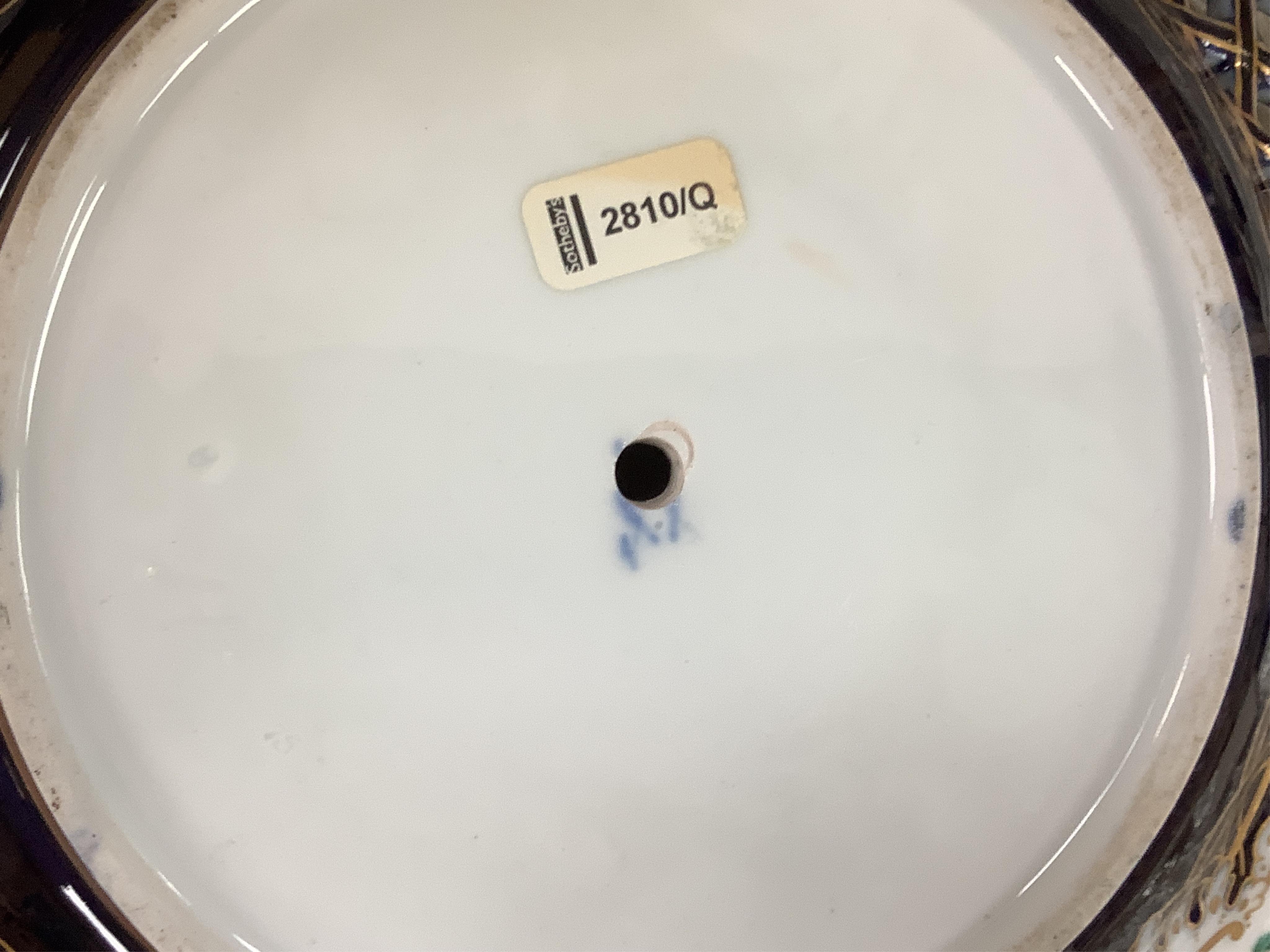 A pair of late 19th century Meissen three tier cake stands with figural tops, 48cm high